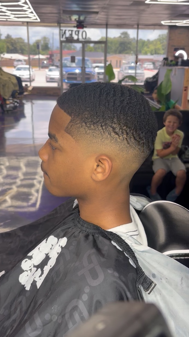 Waves and fade haircut by JT's Clips at Alpha League Barbershop